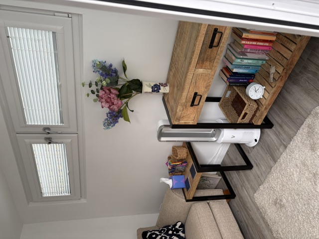 A quiet corner with books and flowers